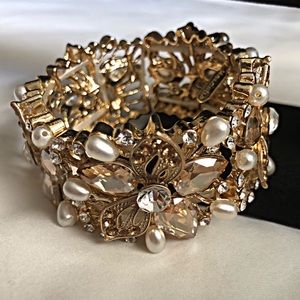 Beautiful gold bracelet with bling and pearls